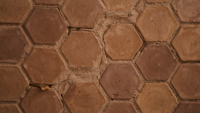 Top view of brown hexagonal terracotta tile pavement pattern