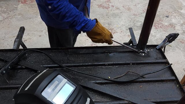 Handyman Tracing Screwdriver Along Edge of Metal Sheet Door Strip