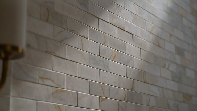 Perspective close up of white marble brick tile wall