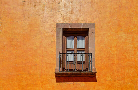 Colonial style facade with balcony and window, Queretaro, Mexico.
