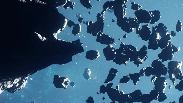An asteroid field with numerous rocks floating in space against a bright blue background. The view captures the vastness of outer space with no signs of planets.