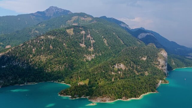 Wolfgangsee Lake in Austria, 4k. Scenic nature view over Wolfgangsee lake. Wolfgangsee lake with mountain landscape. Landscape of mountain peak and Wolfgangsee lake. Nature landscape