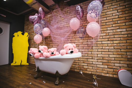 Beary Cute Baby Shower: A whimsical bathtub overflowing with adorable pink teddy bears, adorned with festive balloons and delicate tulle.