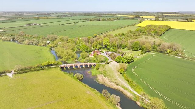 White Mill and Old Bridge over River Stour from a drone, Sturminster Marshall, Dorset, England
