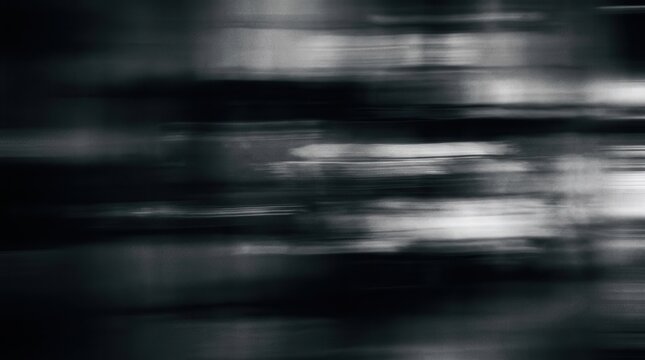 Black and white abstract background featuring horizontal motion blur and heavy grain texture with dark cinematic gradients.