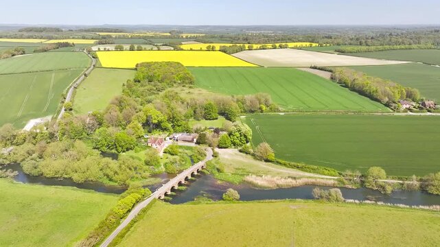 White Mill and Old Bridge over River Stour from a drone, Sturminster Marshall, Dorset, England