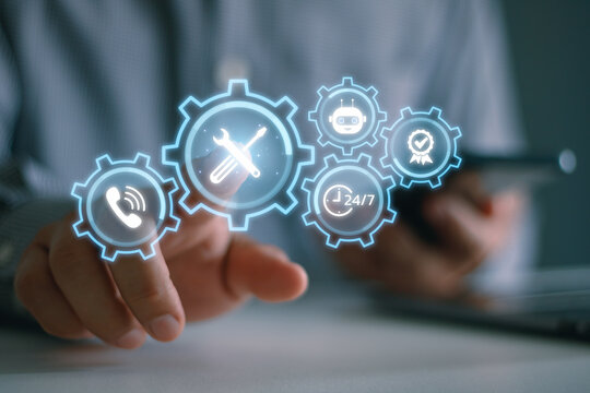 Services concept with engineer using smartphone and laptop computer to monitor customer requests, investigate, and be ready to take action solving problem in customer site.