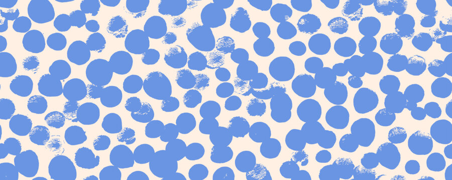 Blue polka dot seamless pattern with scattered bold brush circles. Childish nursery polka dot decor wallpaper, wrapping paper design for baby shower. Round confetti kids birthday seamless background.