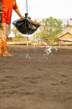 One step in the traditional Kusamba salt-making process: seawater spread over sand, August 17, 2026, Bali, Indonesia.