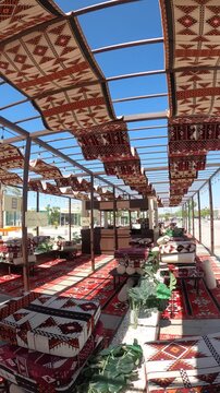 View from a traditional outdoor seating area showing the beautiful Masjid Quba in Medina.