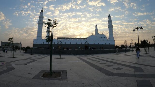 Beautiful sunrise view of Masjid Quba and its large courtyard in Medina.