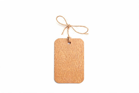 Blank rustic wooden tag with string isolated on white background mockup