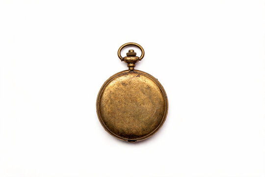 Antique pocket watch closed in aged antique gold metal isolated on white