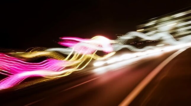 Abstract light trails create a dynamic and vibrant motion blur effect against a dark background perfect for modern design projects needing energy and visual impact