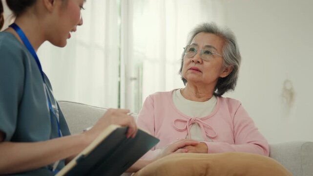 Elderly woman receiving caregiver support home nursing care with calm conversation and attentive health visit, caregiver and nursing home support elderly care with calm talk and gentle hands