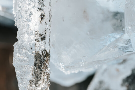  translucent blue ice with frozen bubbles and crystalline patterns for climate change,seasonal design,frozen water themes,purity branding,wellness visuals.frozen texture