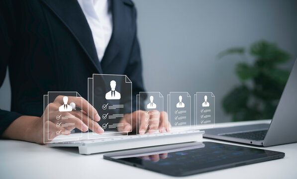 Business professional managing digital employee profiles on laptop showing recruitment workflow talent management hiring record staff selection technology and workforce organization for companies