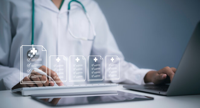 Physician using laptop with digital medical records interface showing healthcare documents patient data clinical information electronic health records technology and AI data management system