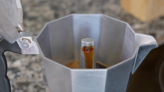 Fresh Espresso Coffee Pouring from Moka Pot Spout