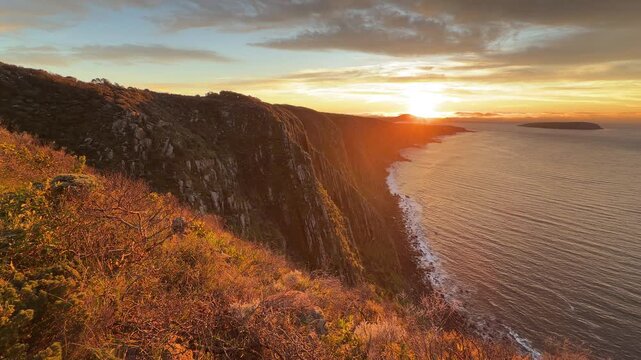 Spectacular sunrise panning over the Waitpinga cliffs and ocean in South Australia in 4k footage