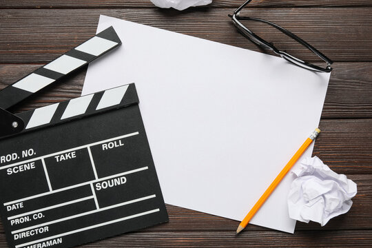 Screenwriting and film production, blank paper with clapperboard and pencil for creative script writing and movie industry planning on wooden desk