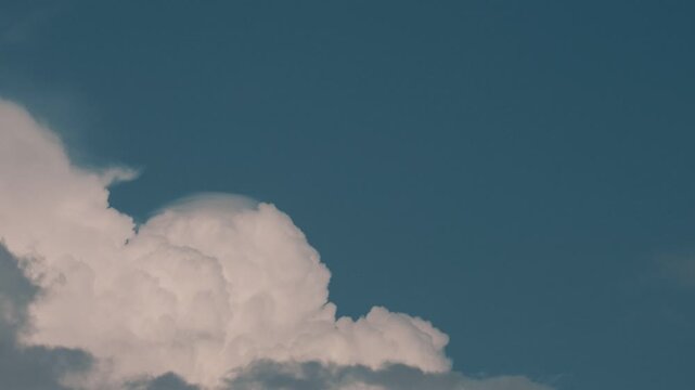 Deep blue sky and cumulus clouds