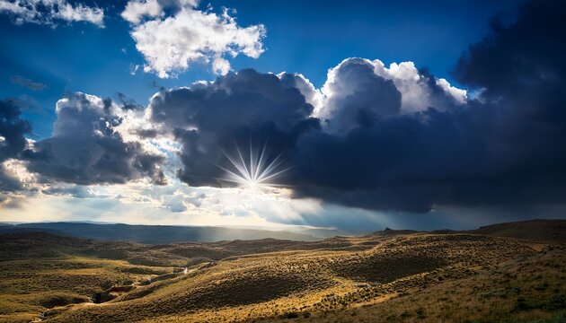 Sun Breaking Through Dramatic Dark Clouds In Blue Sky
