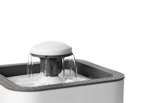Automatic pet water fountain on white background, closeup
