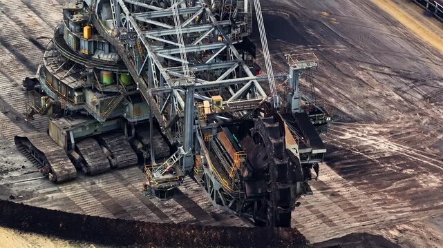 Aerial view of a massive bucket-wheel excavator operating at the Garzweiler surface mine in Juchen, North Rhine-Westphalia, Germany.
