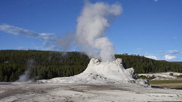 Steam escaping Castle Geyser in Old Faithful area of Upper Geyser Basin, summer vacation exploring Yellowstone National Park
