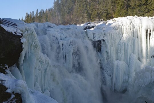 A mighty waterfall with large ice formations in the winter forest, winter, Sweden's highest waterfall, T&auml;nnforsen, &Aring;re&auml;lven, Are, J&auml;mtland, Sweden