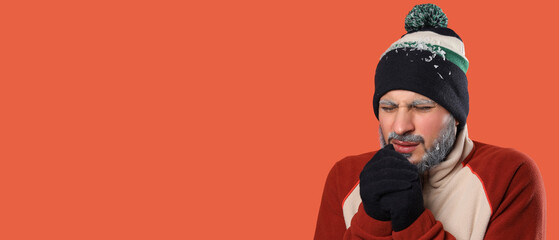 Cold weather health risks, man shivering with frost on beard and winter clothing suffering from hypothermia or extreme freezing temperatures in studio © Pixel-Shot
