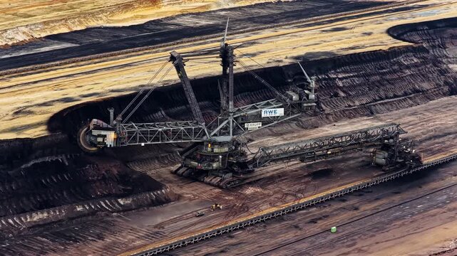 Aerial view of the massive bucket-wheel excavator operating at the Garzweiler surface mine in Juchen, North Rhine-Westphalia, Germany.