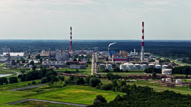 Aerial view of Wloclawek Chemical Industrial Complex with tall chimneys and storage tanks in Wloclawek, Kuyavian-Pomeranian V, Poland.
