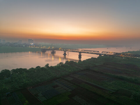 Chuong Duong Bridge over the Red River at Sunrise in Hanoi, Vietnam