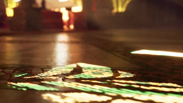 Sunlight shines through stained glass, creating colorful patterns on the stone floor of an old building. The scene shows artistry in light and architecture.