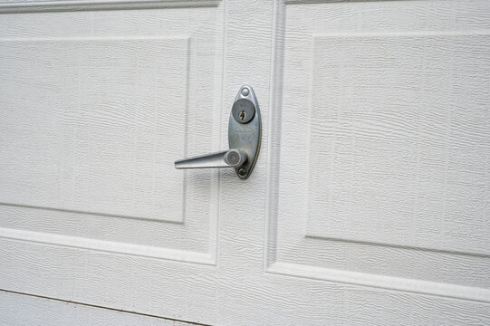Garage door lock and key cylinder close-up