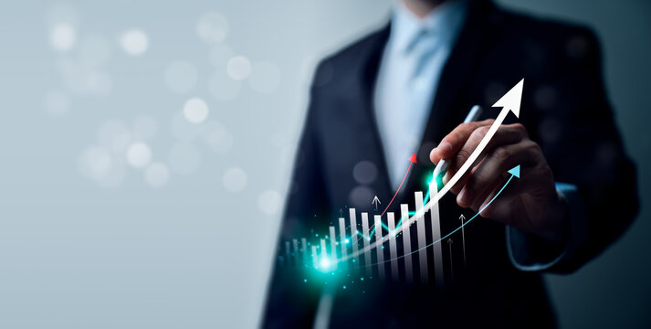 Business growth strategy concept with professional using stylus on virtual rising bar chart showing financial performance, revenue increase, market trend and success projection