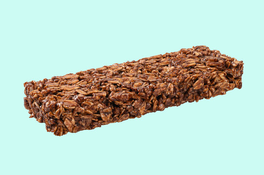Crunchy Oat and Nut Granola Bar on light green Background.