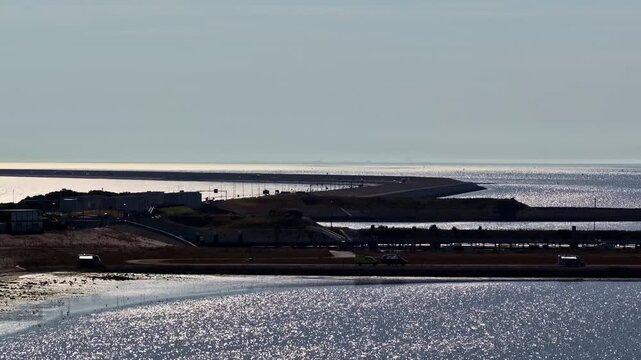Aerial view of Windpark Fryslan wind turbines in the IJsselmeer near the Afsluitdijk causeway in Breezanddijk, Friesland, Netherlands.