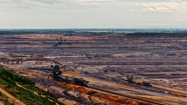Aerial view of Tagebau Hambach open-pit mine with massive bucket-wheel excavators extracting coal in the industrial landscape of Elsdorf, Nordrhein-Westfalen, Germany.