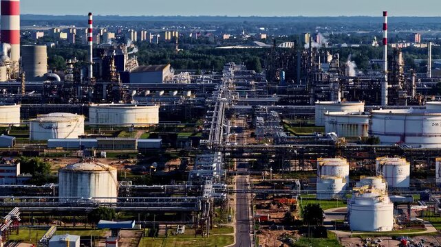 Aerial view of the Orlen Plock Production Plant featuring industrial storage tanks, pipelines, and processing facilities in Plock, Masovian Voivodeship, Poland.