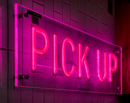 Neon Pink Pick Up Sign at a Coffee Shop