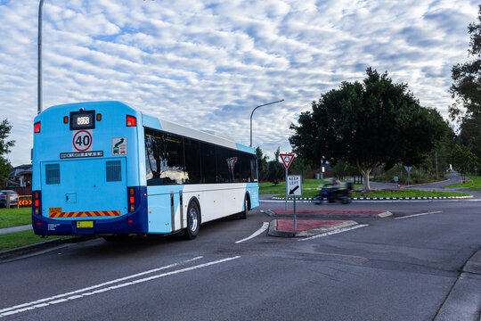 School bus traveling on pickup route in Singleton suburb