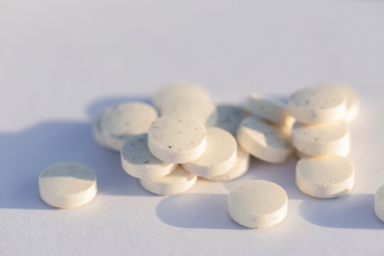 Zinc supplements in tablet form for general wellbeing on white