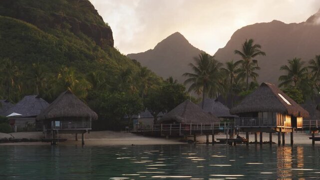 Travel vacation luxury resort hotel overwater bungalows on paradise beach. Romantic holidays destination on Moorea, French Polynesia. Raw video.