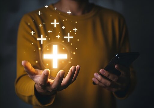 Person holding a smartphone with glowing plus sign icons floating above their open palm hand