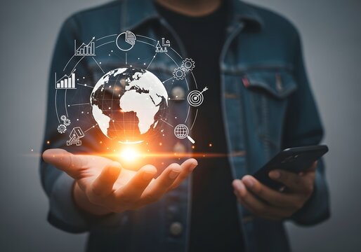 Person holding glowing digital earth globe with business data network graphics floating above hand