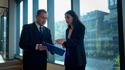 Fototapeta premium Business colleagues discussing work and strategy in meeting room of company