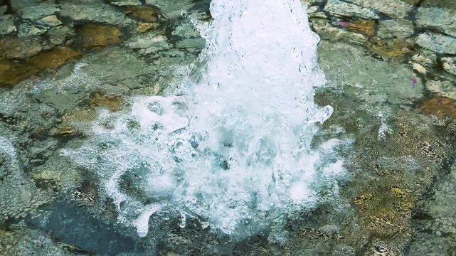 Water Jet Splashing Over Stone Fountain at Shiokaze Park in Tokyo